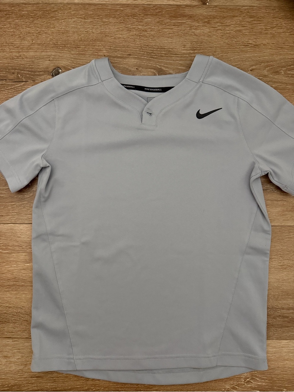 Nike Youth Light Gray Short Sleeve Athletic Tee with Black Swoosh